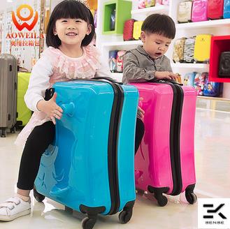 kids sit on suitcase