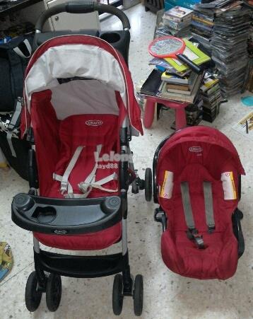 maroon car seat and stroller